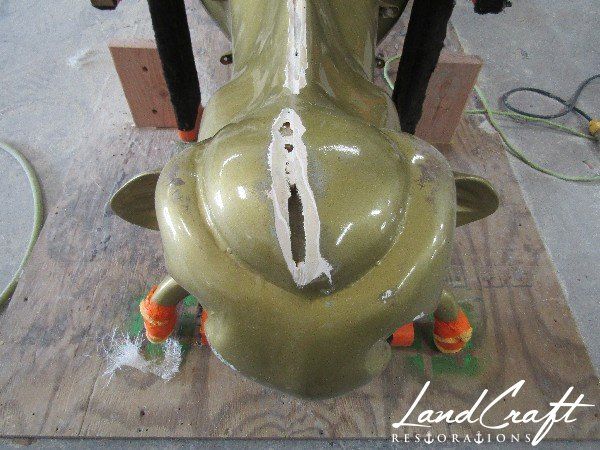 Top Cow art piece statue fiberglass structural repairs in process