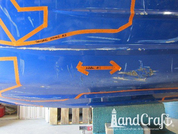 Yamaha waverunner with multiple areas of damage on the bottom hull