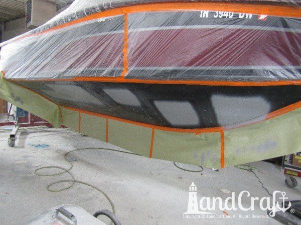 Aluminum boat in refinishing stage after repairs have been made