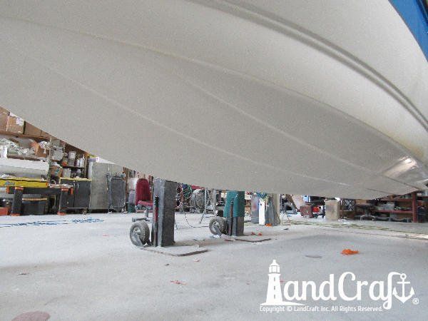 Gelcoat refinishing process near completion on bottom of a Bryant boat