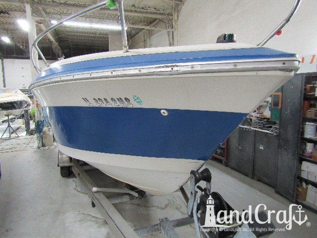 Wellcraft boat before exterior repairs and refinishing