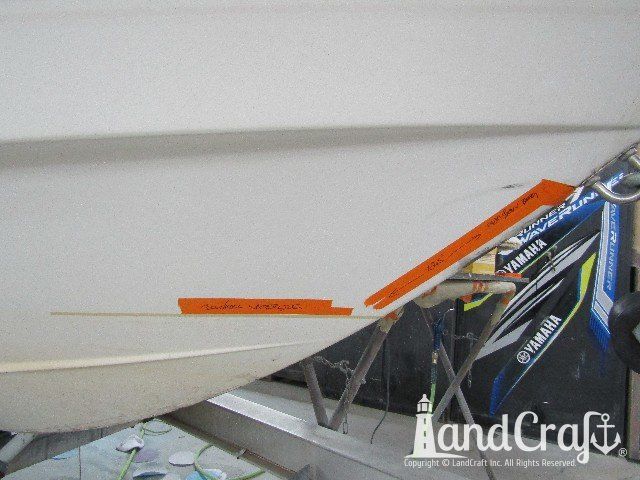 Wellcraft boat in process of exterior fiberglass and gelcoat repair