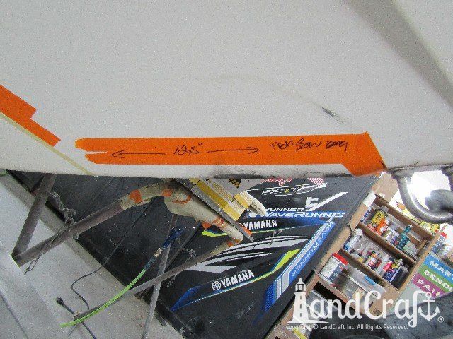 Wellcraft boat in process of exterior fiberglass and gelcoat repair