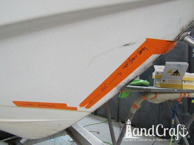 Wellcraft boat in process of exterior fiberglass and gelcoat repair