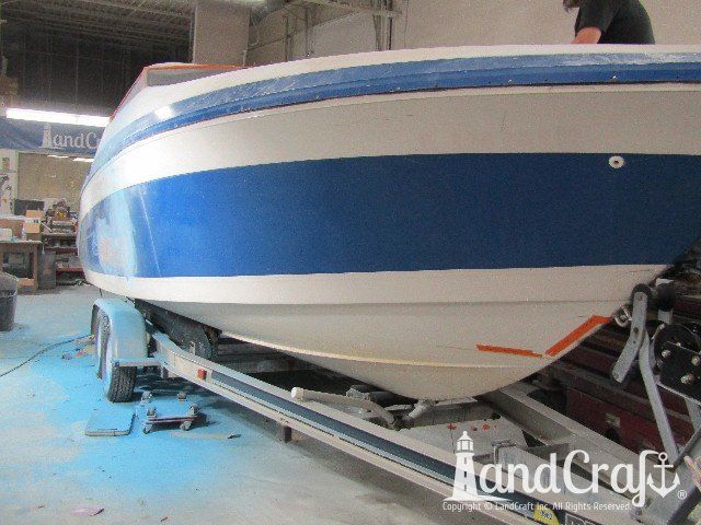 Wellcraft boat in process of exterior fiberglass and gelcoat repair