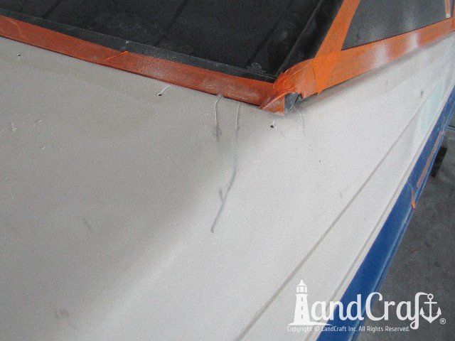 Wellcraft boat in process of exterior fiberglass and gelcoat repair