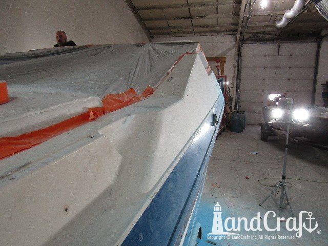 Wellcraft boat in process of exterior fiberglass and gelcoat repair