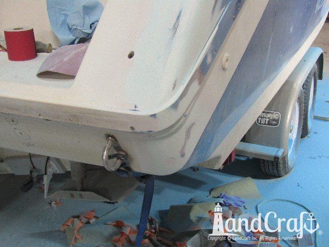 Wellcraft boat in process of exterior fiberglass and gelcoat repair
