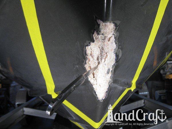 Grounding damage on hull of Nauticstar center console fiberglass boat