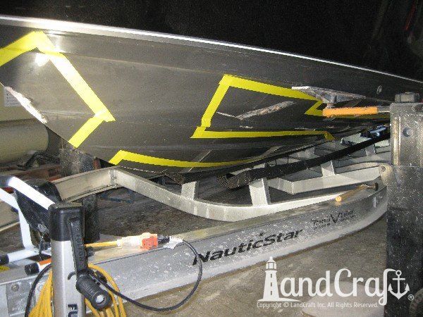 Grounding damage on hull of Nauticstar center console fiberglass boat