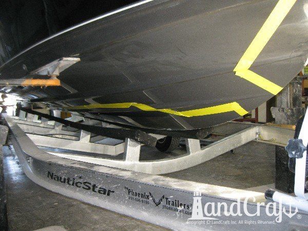 Grounding damage on hull of Nauticstar center console fiberglass boat