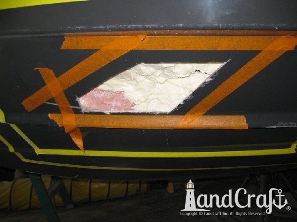 Repairing grounding damage on the hull of Nauticstar center console fiberglass boat