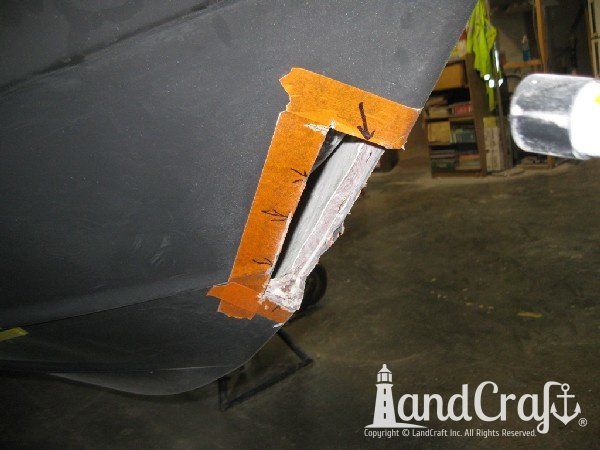 Repairing grounding damage on the hull of Nauticstar center console fiberglass boat