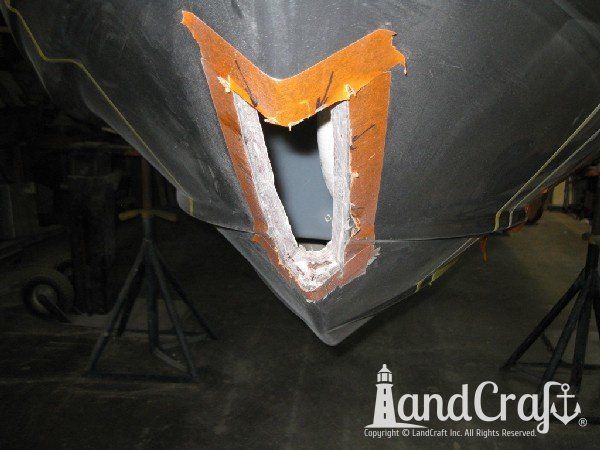 Repairing grounding damage on the hull of Nauticstar center console fiberglass boat