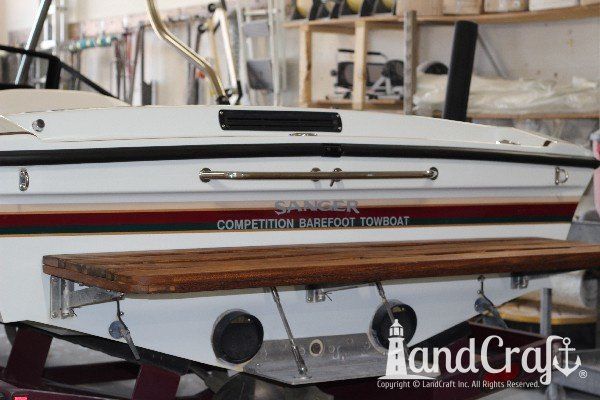 Sanger boat exterior refurbishing complete with glossy finish and restored teak swim platform