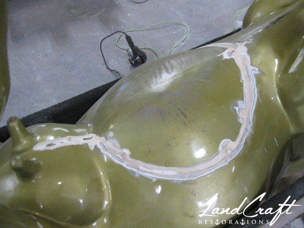 Top Cow art piece statue fiberglass structural repairs in process