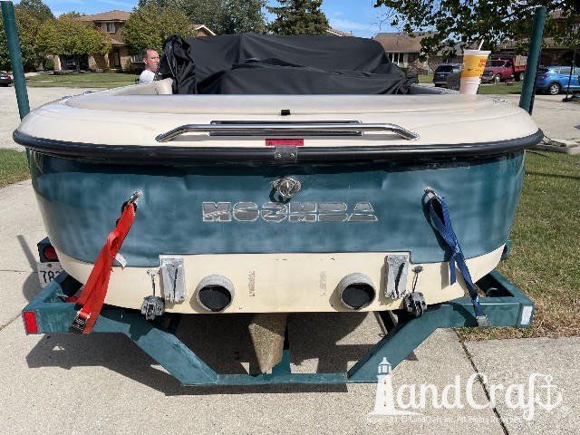 Moomba wakeboard boat with faded and chalky exterior finish