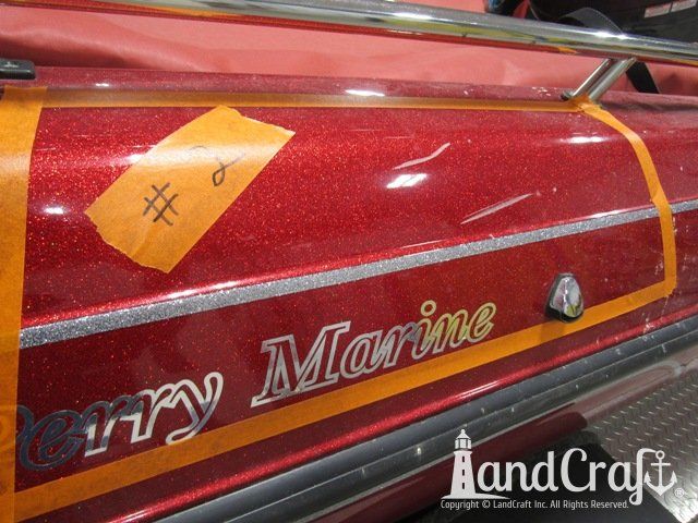 Skeeter boat with deep scratch running through metal flake finish