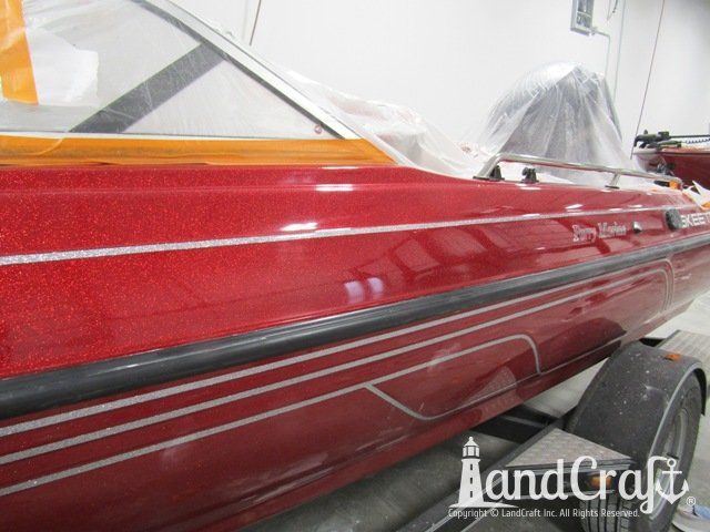 Skeeter boat with scratches repaired and a glossy metal flake finish
