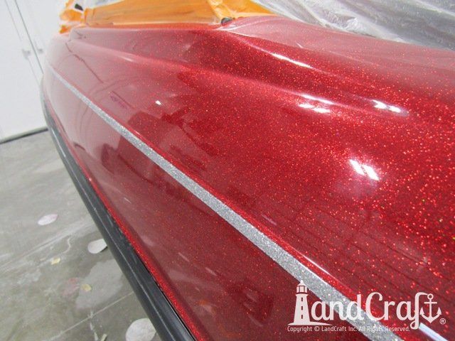 Skeeter boat with scratches repaired and a glossy metal flake finish