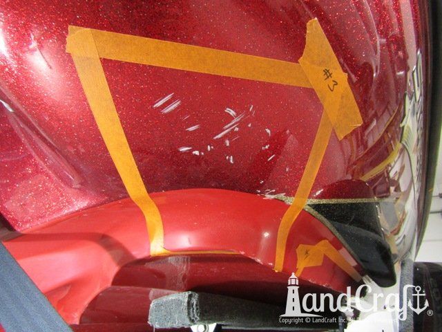 Stratos boat with scrapes and gouges