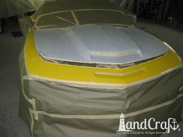 Fiberglass Chevy Camaro hood in body work and paint process