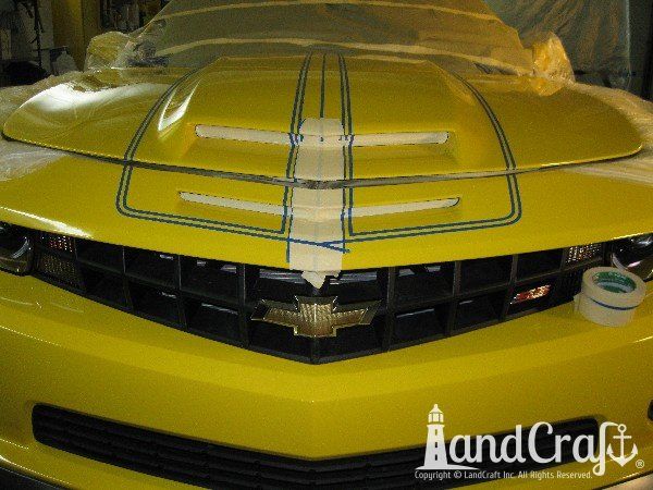 Fiberglass Chevy Camaro hood in rally stripe paint process