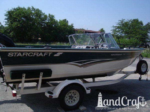 Aluminum Starcraft boat with side damage