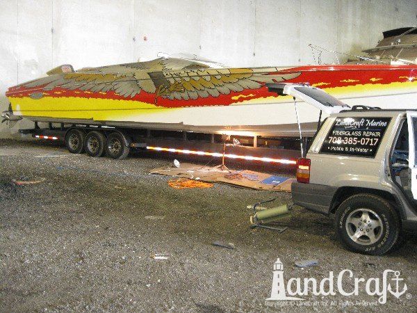 High performance catamaran boat getting an emergency gelcoat repair