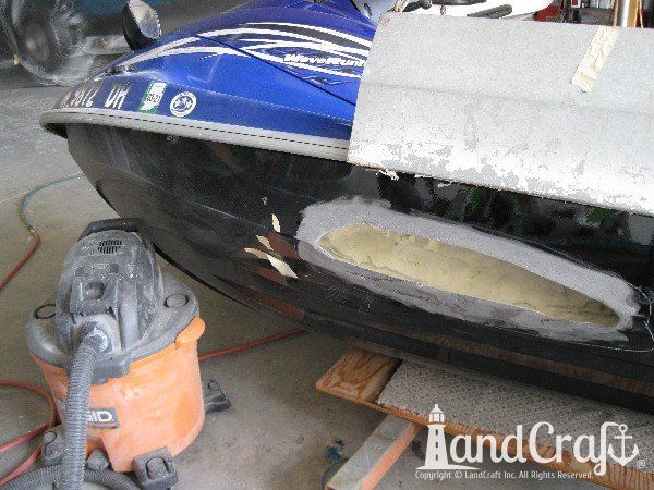 Waverunner with severe side damage in process of repair