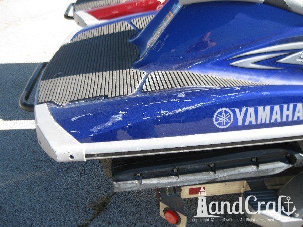 Blue Yamaha with scratches along the side gunnel