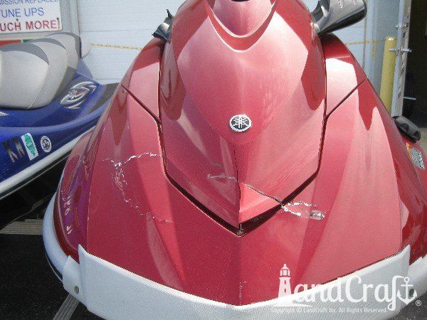 Red Yamaha with damage across the front end