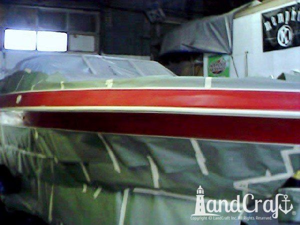 Complete exterior refinishing of a boat in process