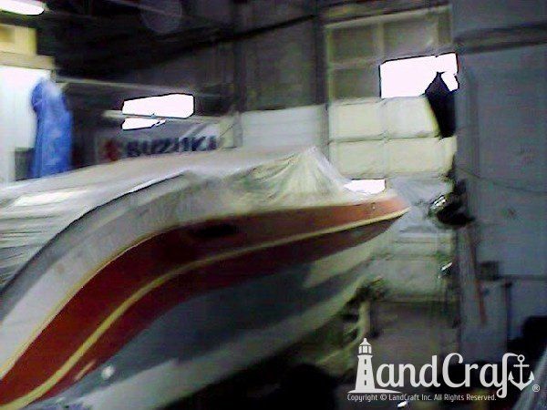 Complete exterior refinishing of a boat in process