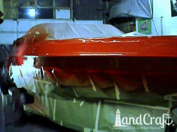 Complete exterior refinishing of a boat in process