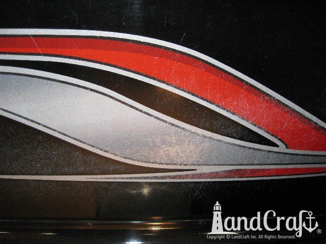 Picture of scratches through paint and decals on an aluminum boat