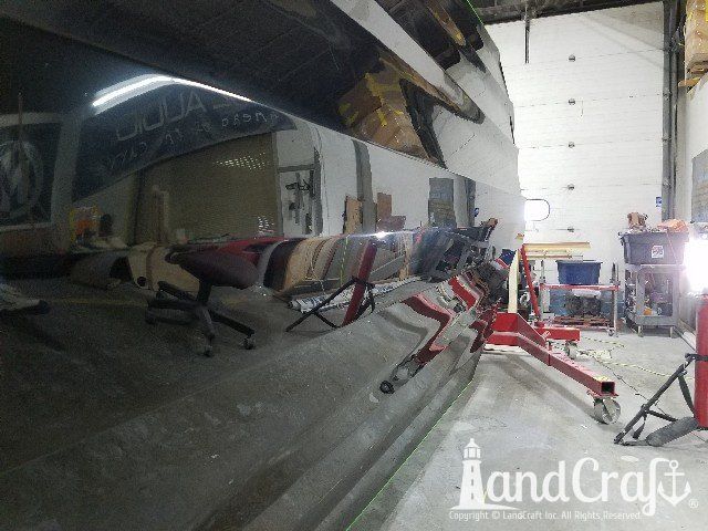 Completed structural repairs and refinishing on the bottom of a fiberglass fishing boat