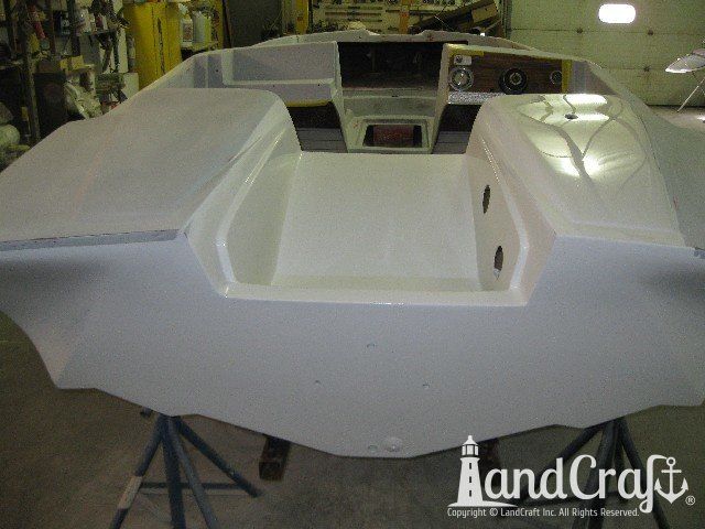Glastron boat in the refinishing process