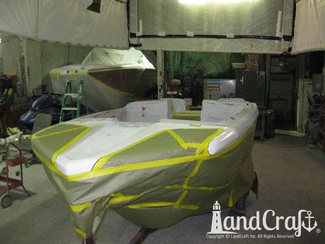 Glastron boat in the refinishing process