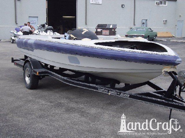 Malibu Echelon boat in process of color change from purple and white to orange and black