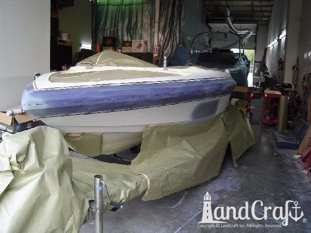 Malibu Echelon boat in process of color change from purple and white to orange and black