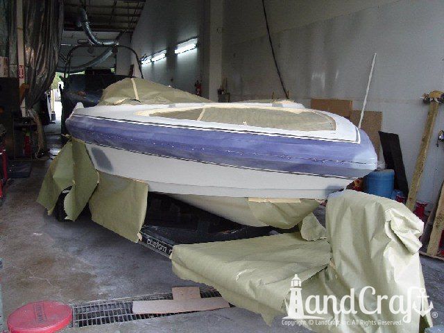 Malibu Echelon boat in process of color change from purple and white to orange and black