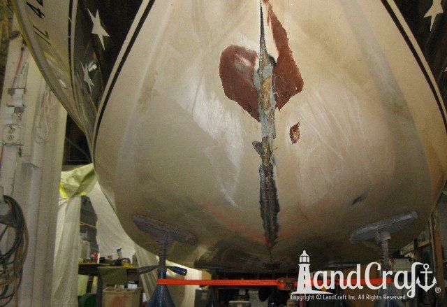 Mastercraft Stars & Stripes boat on a lift and ready for exterior repairs and gelcoat refurbishing