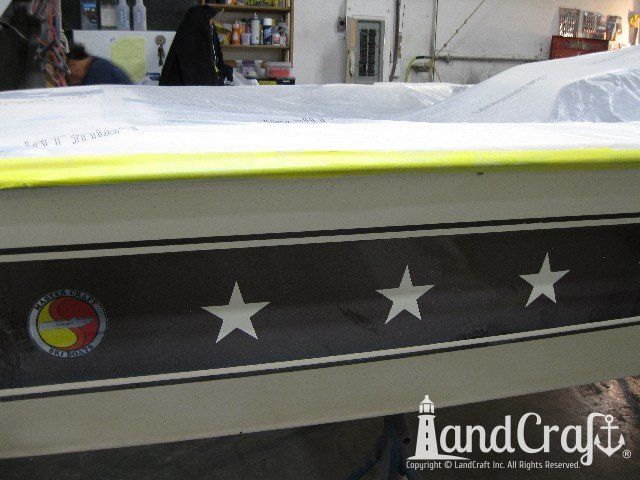 Mastercraft Stars & Stripes boat on a lift and ready for metalflake gelcoat repair and restoration