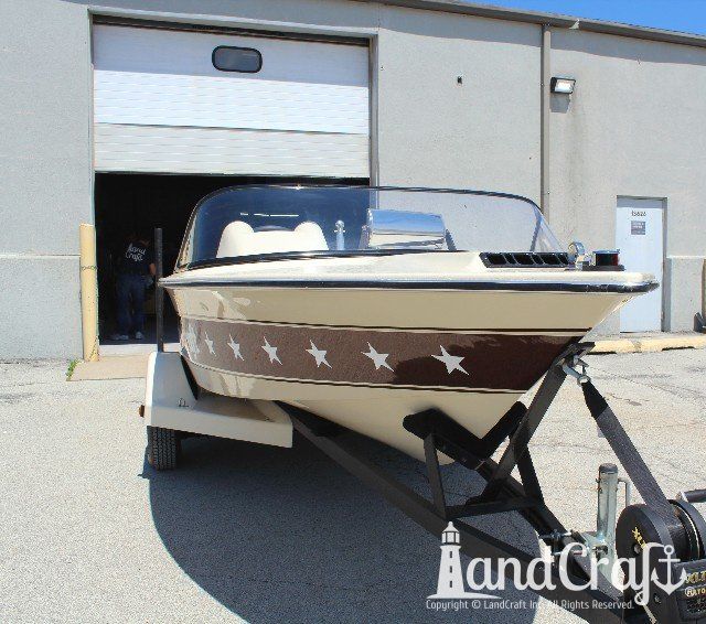 Mastercraft Stars & Stripes boat after exterior restoration with glossy metalflake and new decal stars applied