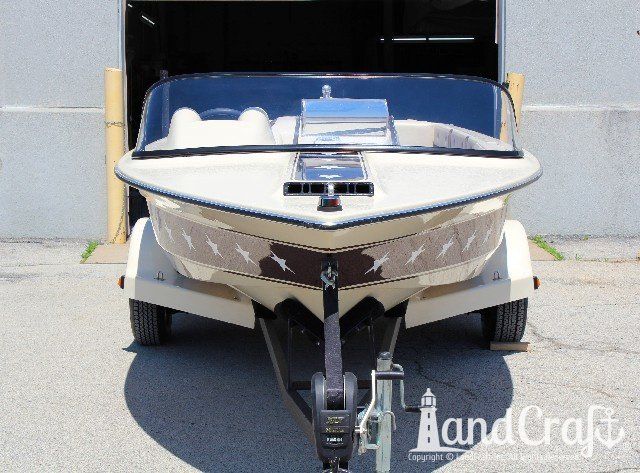 Mastercraft Stars & Stripes boat after exterior restoration with glossy metalflake and new decal stars applied