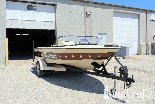 Mastercraft Stars & Stripes boat after exterior restoration with glossy metalflake and new decal stars applied