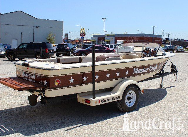 Mastercraft Stars & Stripes boat after exterior restoration with glossy metalflake and new decal stars applied
