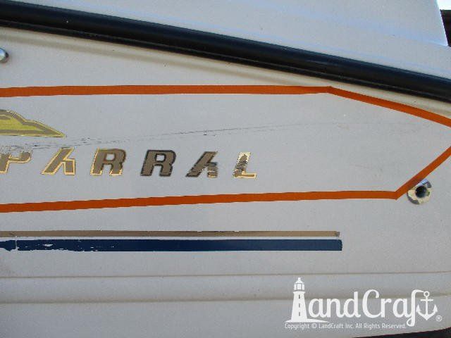 Dock rash damage through gelcoat and emblem on Chaparral fiberglass boat
