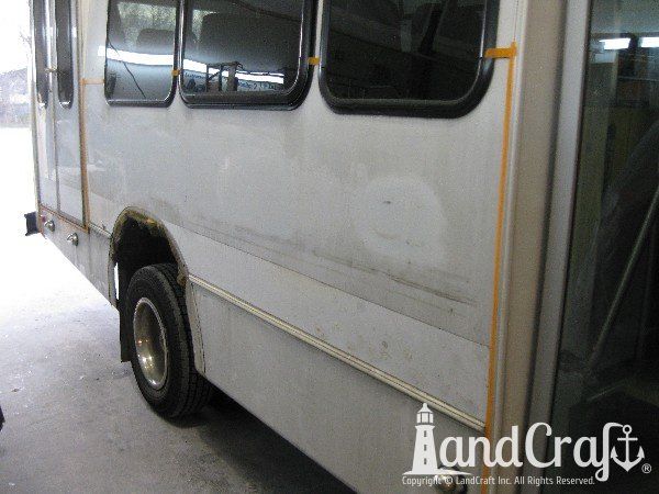 Fiberglass bus damage requiring repair and refinishing